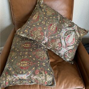 Sage green metallic lumbar pillows.